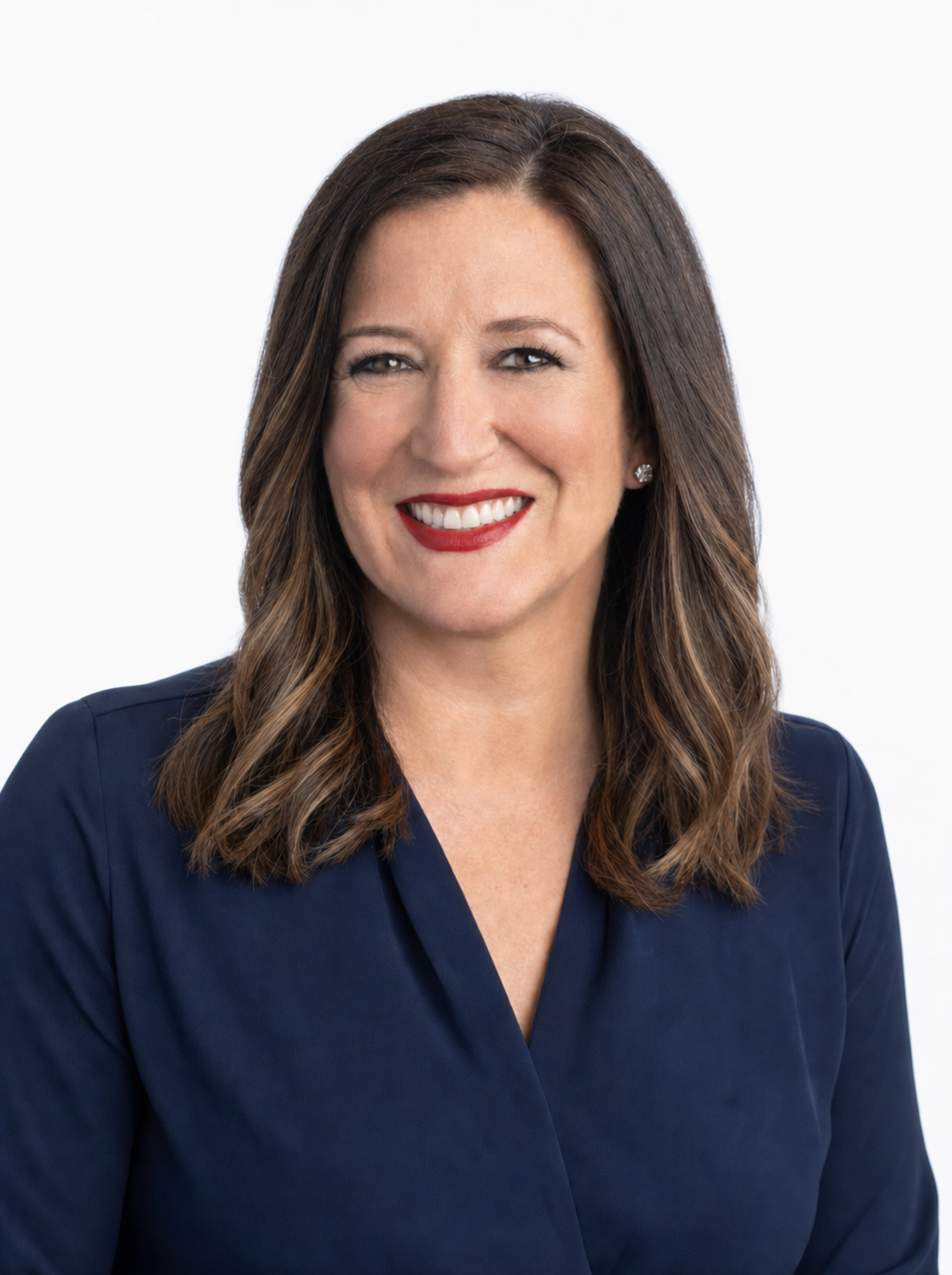 A professional studio headshot of Colleen Carcone smiling warmly against a clean, plain white background
